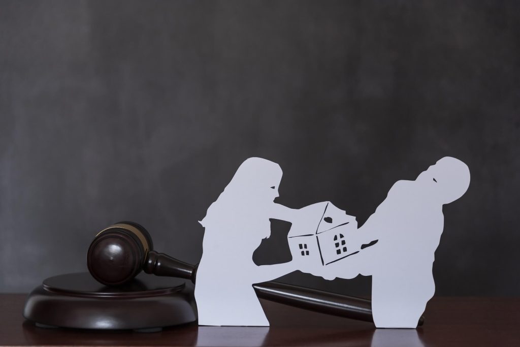 spouses fighting each other over property in divorce